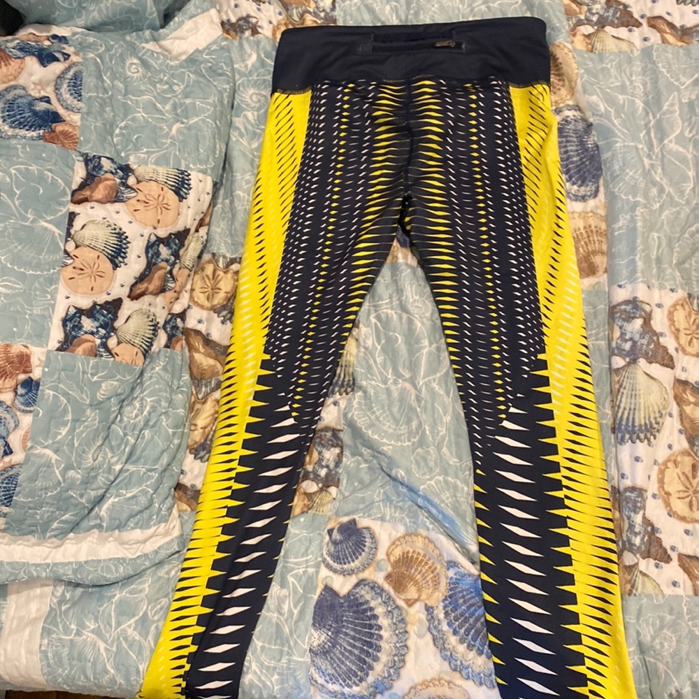 Navy blue and yellow leggings. Womens meadium with zipper on back. worn once